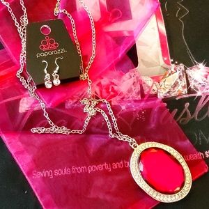 Long necklace will large jewel with matching earrings.  💕